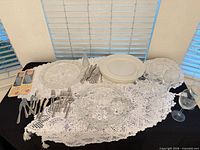 Full lot with lace runners, doilies, hobnail plates, flatware, white plates, glasses, bud vase
