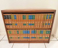 Front view of full 54-volume set arranged in bookcase