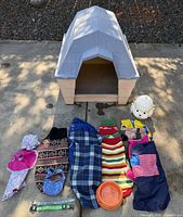 Group shot of doghouse, apparel, collars, bandana, hat, bowl