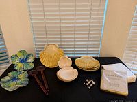 Overall view of melamine plates, utensils, napkins and shells