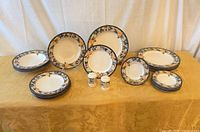 Overview of Mikasa Garden Harvest dinnerware showing plates and shakers