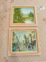 Front view of both framed paintings