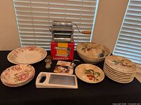 Full lot showing pasta machine, serveware, grater and shakers