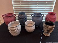 All seven pottery pieces grouped
