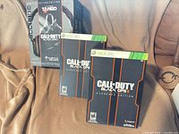 Turtle Beach Ear Force Tango headset box with two Call of Duty Black Ops II Hardened Edition boxes
