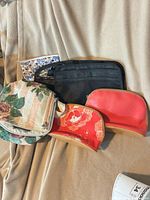 All five bags displayed on fabric surface