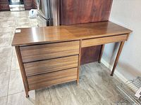 Front view showing top, single drawer front and left box base