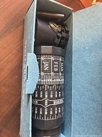 Star finder inside box showing month/hour scales and cap