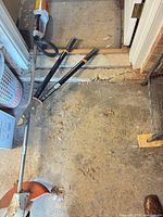 Overall view showing Stihl string trimmer body, loppers on floor