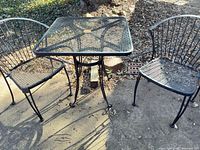 Bistro set showing table and both chairs on patio