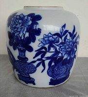 Front view showing blue floral design on white porcelain body