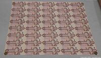 Full sheet of 40 Canadian $2 notes displayed flat