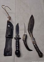 All three knives and sheath laid out