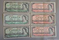 Fronts of three 1954 one-dollar notes and three 1954 two-dollar notes