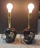 Front view of both helmet lamps illuminated