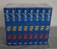 Front view of shrink-wrapped eight-pack showing side spines with SONY, ED Max, T-120 markings