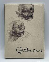 Front of sealed box set with Gollum sketches and title