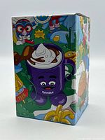 Front view of sealed Grimace mug box showing character graphic