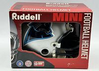Front-left view of boxed Riddell Carolina Panthers mini helmet