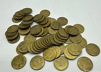 Pile of 71 brass Captain Jack's Fun Center tokens
