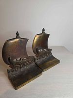 Front view of both brass Viking ship bookends
