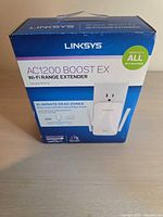 Front of retail box showing Linksys RE6400 branding and product image