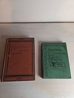 Front covers of both books showing titles and cloth bindings