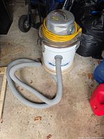 Full view of Mastercraft wet/dry vacuum with hose and cord