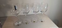 Four Waterford crystal wine glasses displayed upright