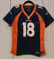Front full view of jersey showing color scheme, number, and size medium tag