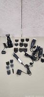 All clippers, trimmers, attachments and adapters laid out