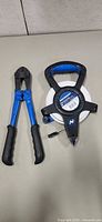 Bolt cutters and tape measure together