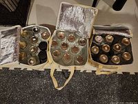 Three insulated bags opened showing jars inside