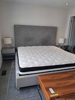 Full view of bed frame with mattress placeholder, headboard attached