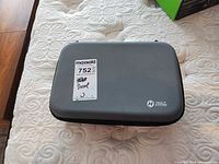 Closed hard-shell case with Holy Stone logo