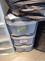 Front view of three-drawer plastic storage unit