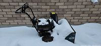 Left side view snowblower with chute and 10/28 marking