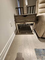 Full view of side table beside chair