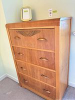 Full front view of dresser showing four drawers, handles, veneer pattern, and overall finish