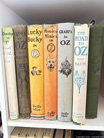 Seven Oz series hardcovers on shelf