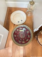 Decorative plate, charger and glass oil lamp grouped