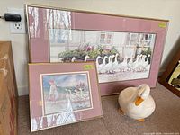 Large and small framed prints with ceramic goose