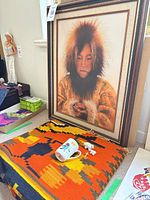 Full view of framed portrait with surrounding items