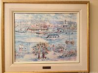 Framed harbor scene print with mat and gold frame