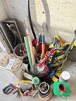 Wide view of lot showing tools, pots, salt bag, fittings