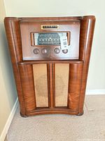 Front view of General Electric JK-76 console radio cabinet