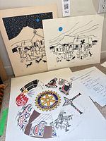 Overall view of all three prints leaning against wall