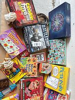 Overall group of board games and tins laid out