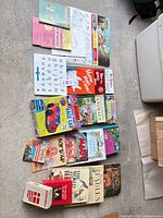 All 19 books and boards laid out on floor