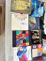 All eight hardcover books laid out showing covers